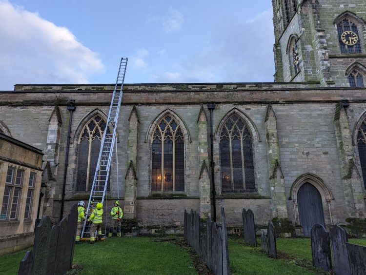 Leicester Time: Swan’s Prayers Answered after she Crash Lands on Church Roof and is Rescued 